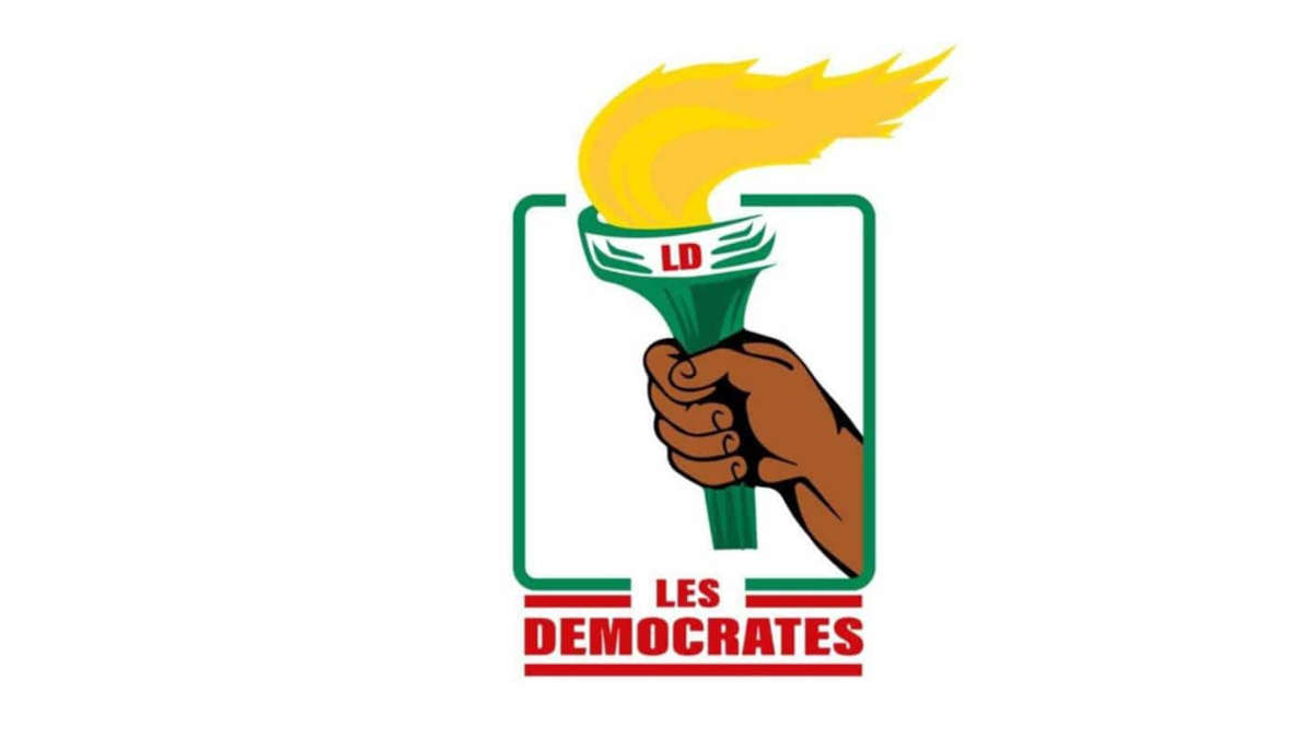 Dessin d une main tenant une torche allumée avec les lettres LD et le texte Les Democrates en rouge sous la torche
