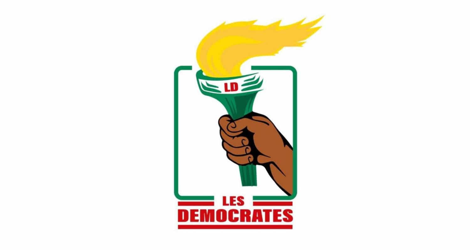 Un logo stylisé d’une main tenant une torche allumée avec les lettres LD et le texte LES DEMOCRATES en dessous